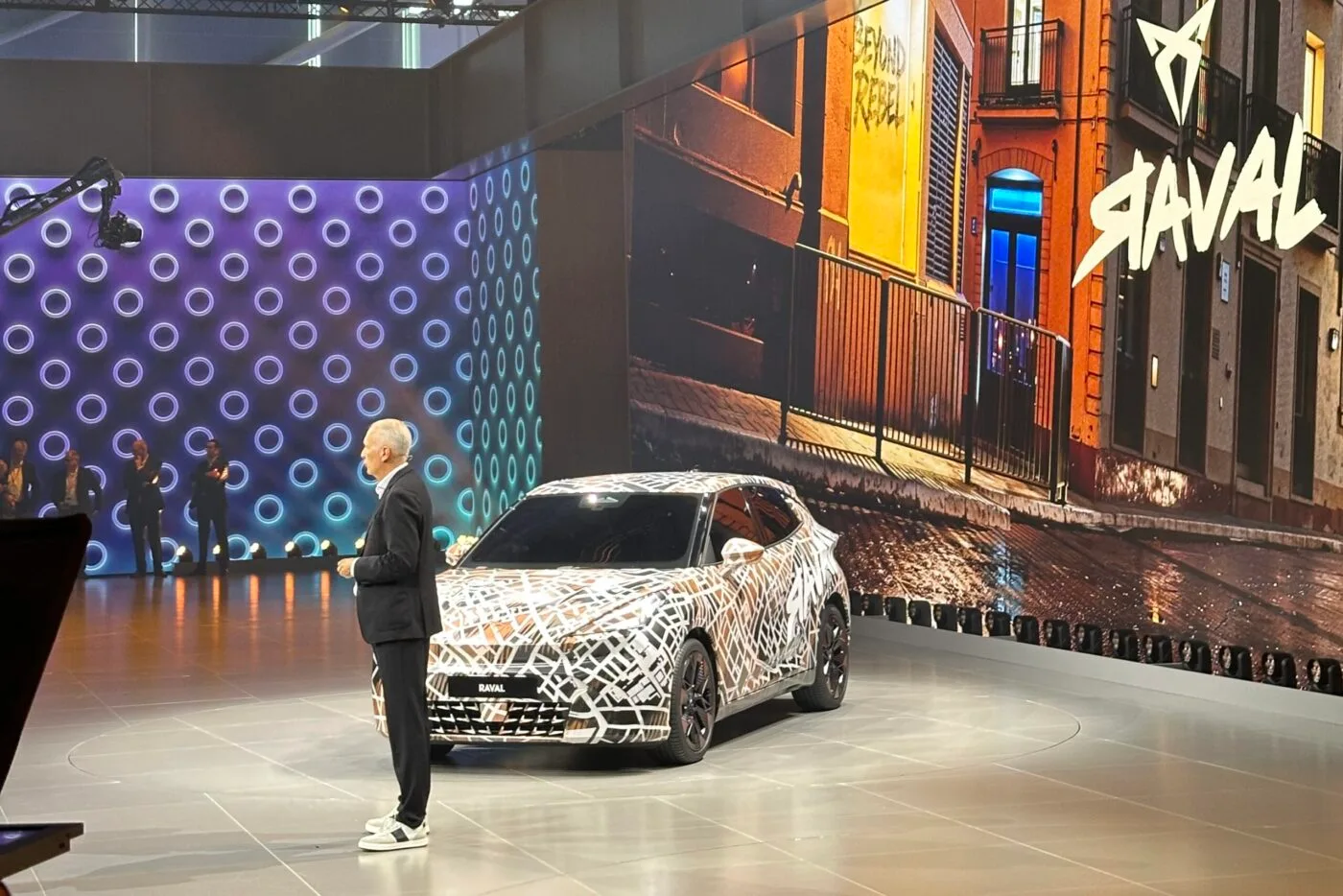 Premium automotive exhibition stand at IAA Munich motor show with dramatic lighting and luxury vehicle display